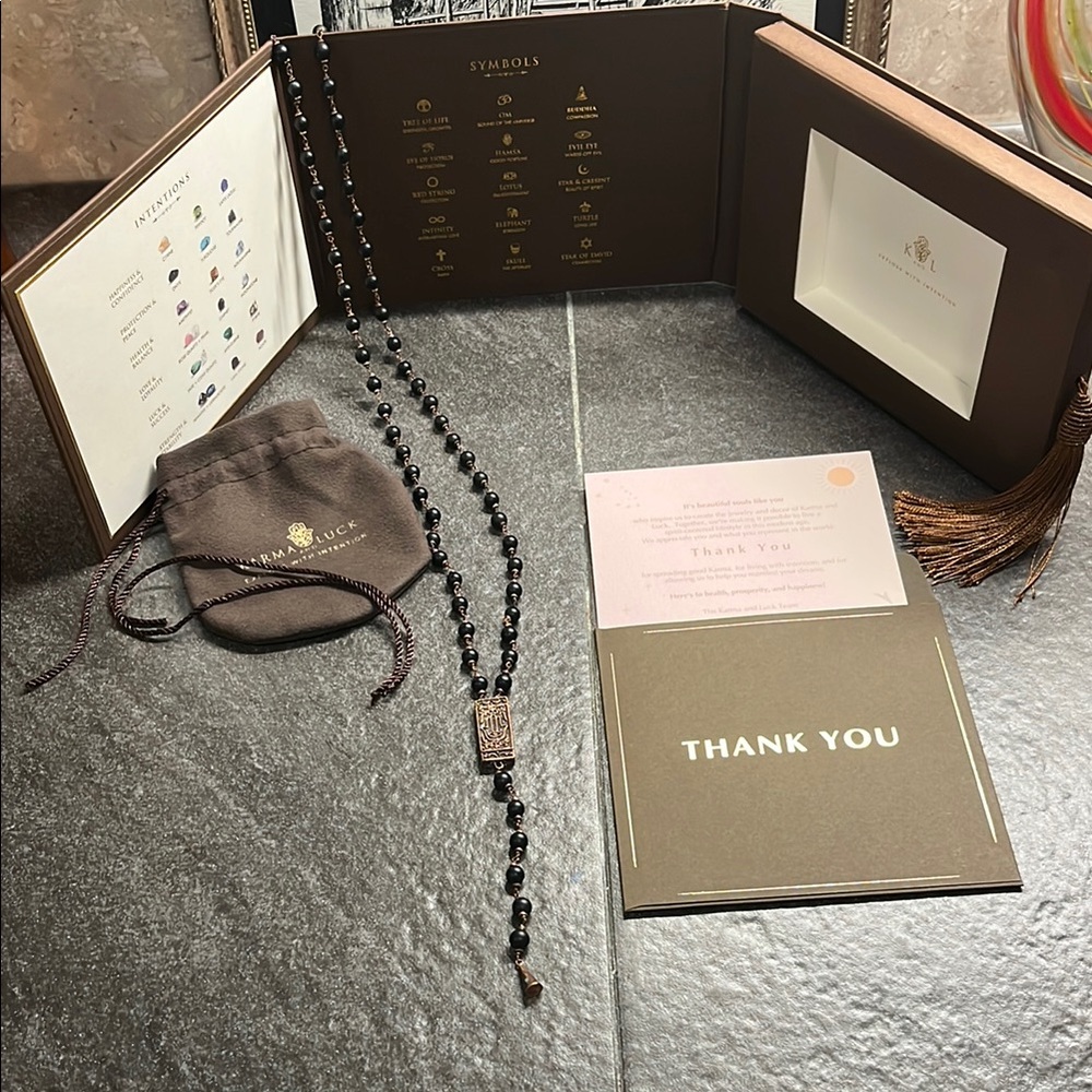 Karma and luck Hamsa necklace.NWT never worn original box as shown.